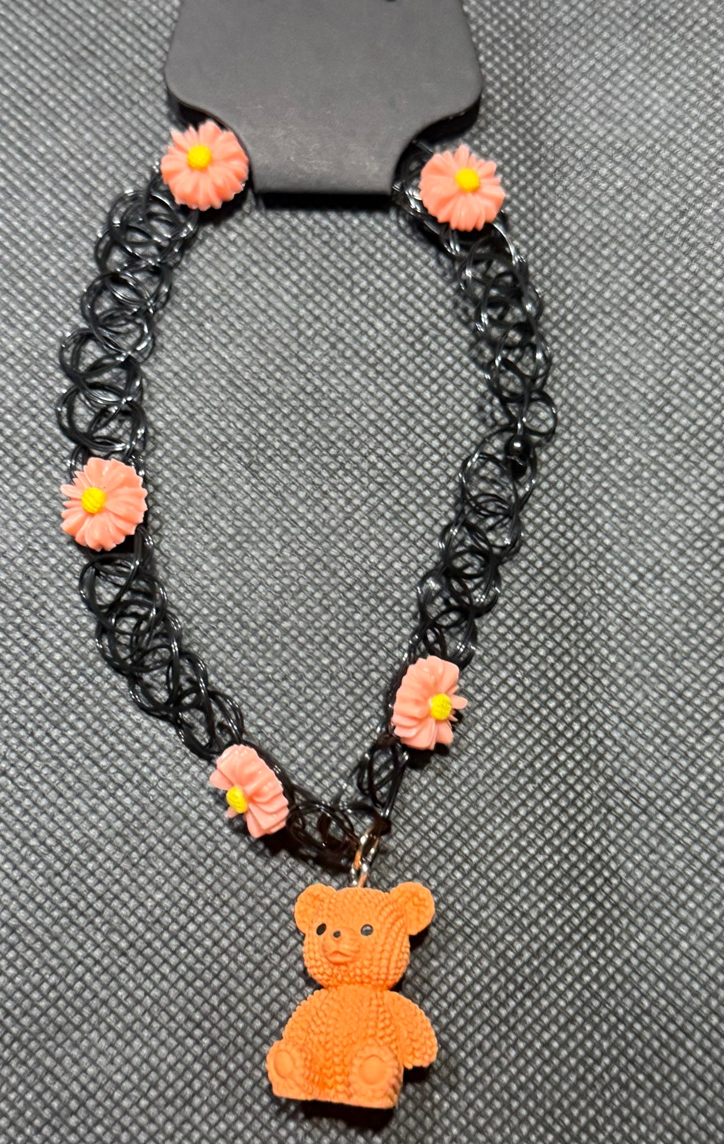 Orange bear with flowers chocker