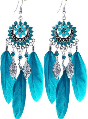 Green earrings with feathers